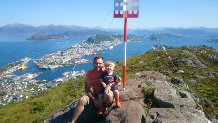 A picture of me and my son Sam, on top of Sukkertoppen with Ålesund in the background